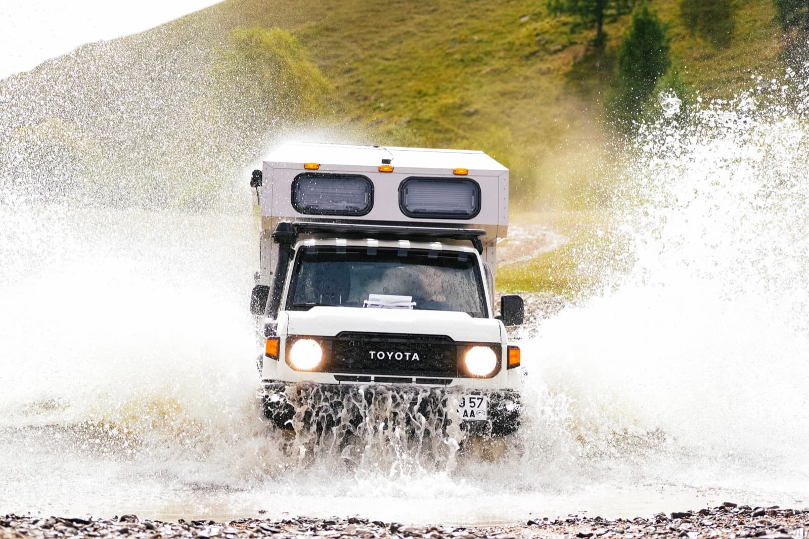 Toyota expedition vehicle crossing a river in Mongolia